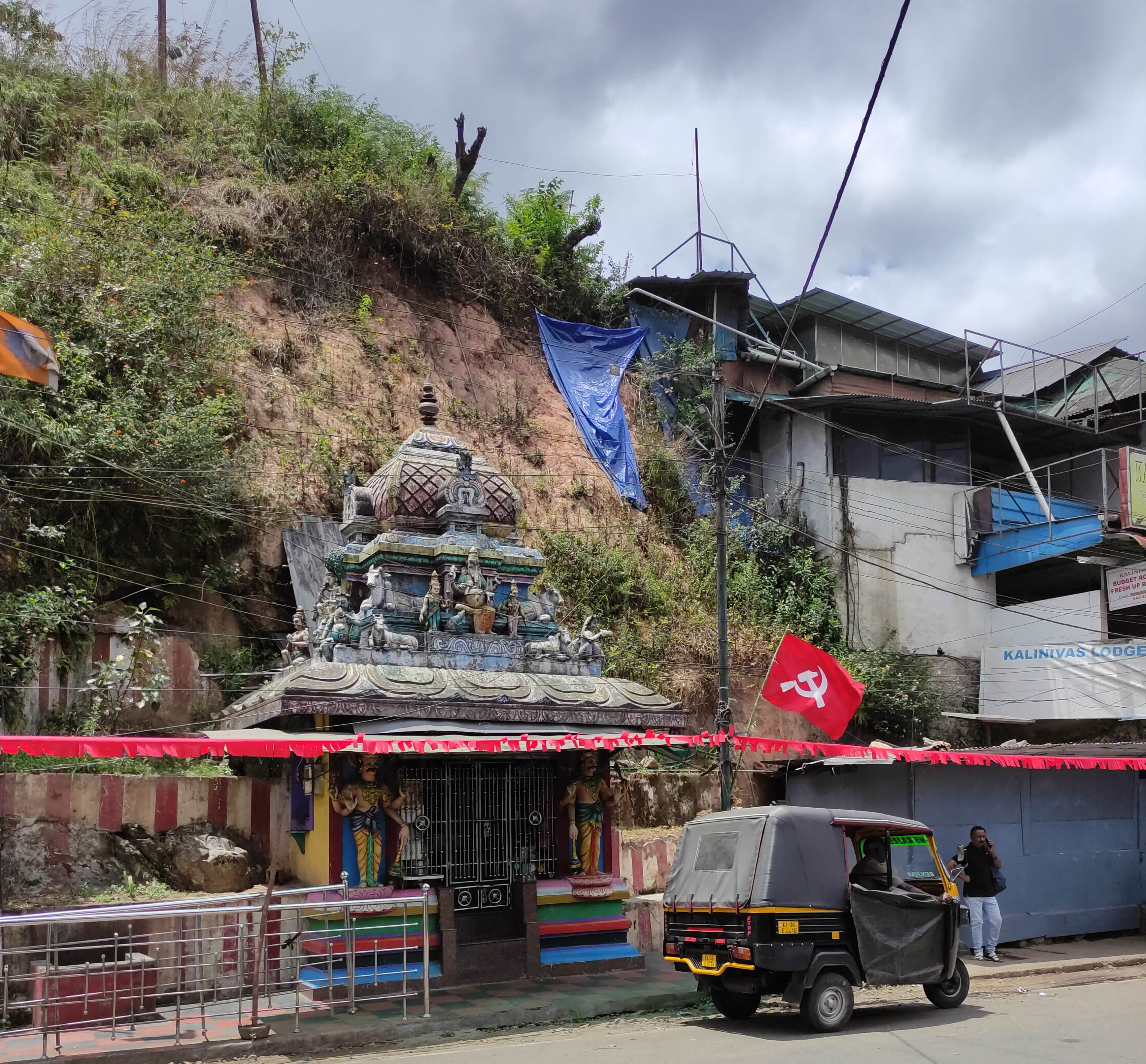 Wherever you go in Kerala, you'll see a communist flag along the roadside somewhere. The Communist Part of India (CPI) have been in government coalitions for about half a century in Kerala. Hammer and sickle flag in front of a Hindu shrine
